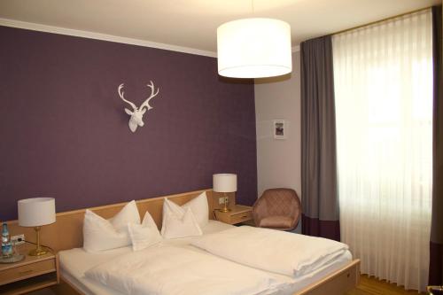 Cama o camas de una habitación en Gasthaus Assenmacher