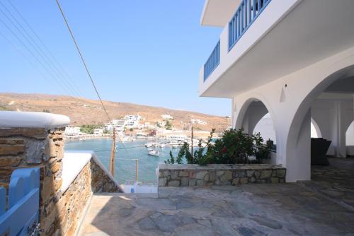a house with a view of a harbor at Onar Loutra, Kythnos in Loutrá