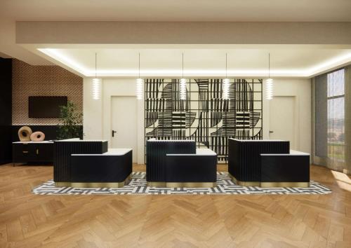 a lobby with black chairs and a table at Doubletree By Hilton Sheffield City in Sheffield
