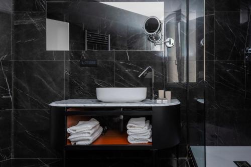 a bathroom with a sink and a shower at Hotel Valeri in Rome