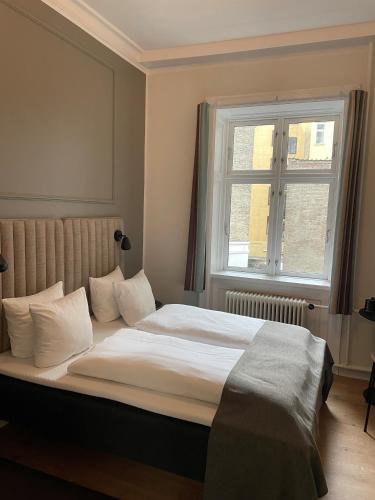 Postel nebo postele na pokoji v ubytování Hotel Sct. Thomas