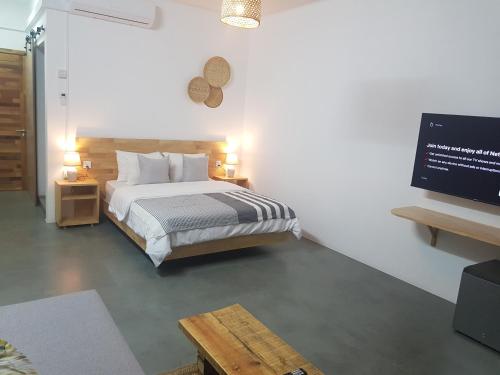 Ένα ή περισσότερα κρεβάτια σε δωμάτιο στο Villas Rocher - Villa 3