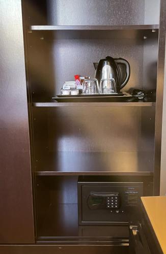 a kitchen with an oven with pots and pans at SM Hotel Sant Antoni in Barcelona