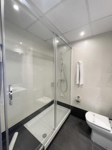 a bathroom with a shower and a toilet at SM Hotel Sant Antoni in Barcelona