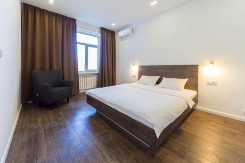 Кровать или кровати в номере Central Apartments Maidan Area