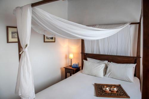 Кровать или кровати в номере Archipelago Sifnos - Seaside Accommodation