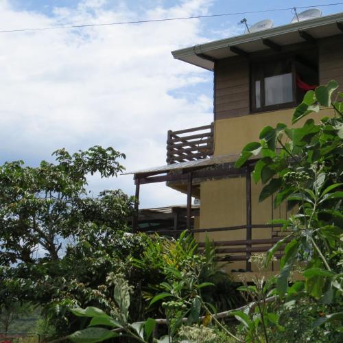 a house with trees in front of it at Rinconcito Verde in Ujarrás