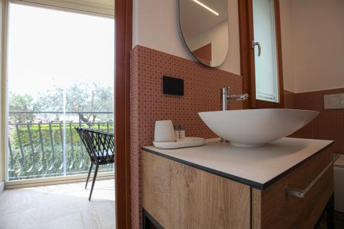 a bathroom with a sink and a mirror at La Giuggiola in Arqua Petrarca