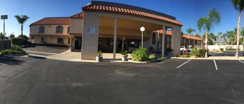 a parking lot in front of a hotel at Calimesa Inn in Calimesa