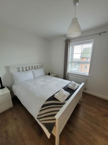 Ένα ή περισσότερα κρεβάτια σε δωμάτιο στο Skylark Apartment
