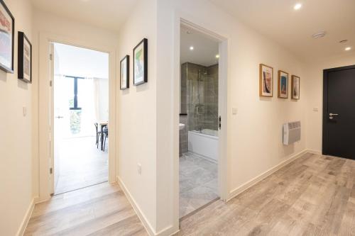 a hallway with a bathroom with a shower and a toilet at GuestReady - A family retreat in Vauxhall in Liverpool
