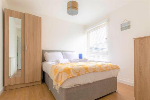 a bedroom with a large bed and a large window at Riverside Rendezvous 1 bedroom Near Airport and City Centre SF in Liverpool