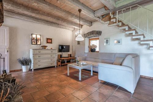 a living room with a couch and a table at Pool Villa Lavanda - Happy Rentals in Šmarje