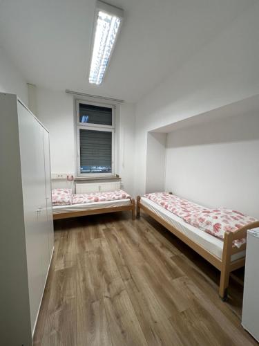 Een bed of bedden in een kamer bij Delta Haus