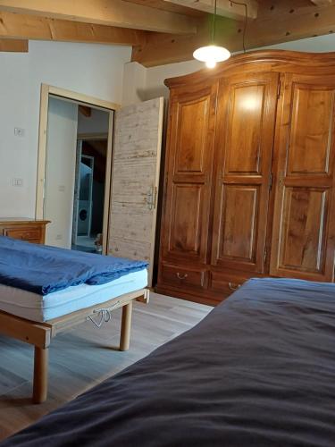 Postel nebo postele na pokoji v ubytování Casa Bresadola - Pellizzano