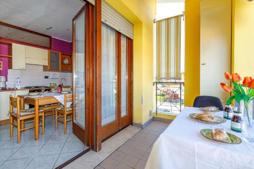 a kitchen with a table with plates of food on it at Magnolia Sirmione - Happy Rentals in Sirmione