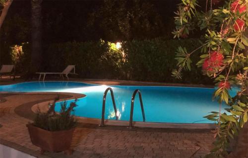 a swimming pool in a yard at night at Gorgeous Home In Giffoni Sei Casali With Outdoor Swimming Pool in Giffoni Sei Casali