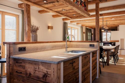 a kitchen with a sink and a counter top at Chalet in Fischbachau