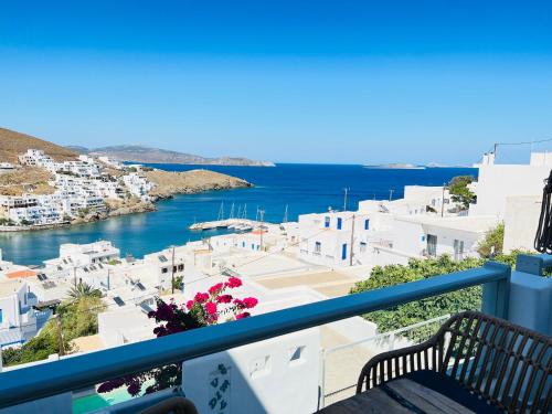 a balcony with a view of a harbor at Gerani Deluxe Houses in Astypalaia Town