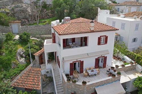 an aerial view of a white house with a patio at Villa Leonard - Comfort Villa in Hydra