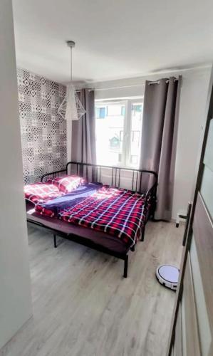 Voodi või voodid majutusasutuse Apartament Gdańsk toas