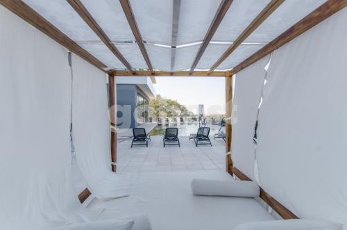 a view from the inside of a room with chairs at Luminous Two-bedroom Apartment In Trinidad in Asunción