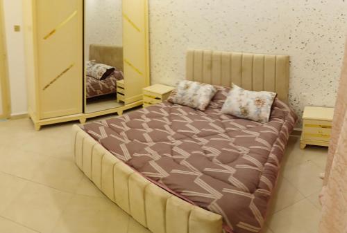 Un pat sau paturi într-o cameră la Artisanat