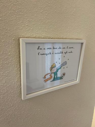 a picture on a wall with a writing on it at Da Ale e De in Isolabona