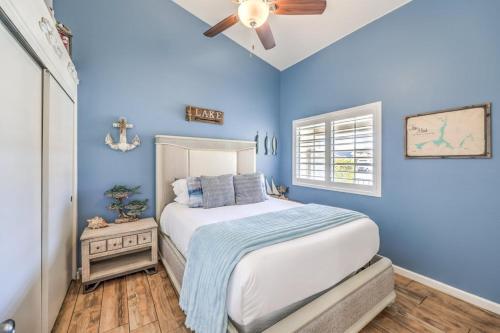 a blue bedroom with a bed and a ceiling fan at Family Fun for Everyone in Las Vegas- 4 Bedrooms, Billiards, Game Room in Las Vegas