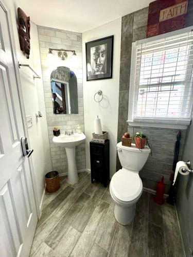 a bathroom with a toilet and a sink at Zen Life Oasis in Atlanta