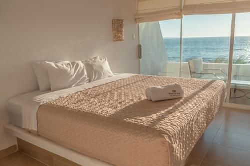 Ένα ή περισσότερα κρεβάτια σε δωμάτιο στο Hotel Beso de Sal Resort