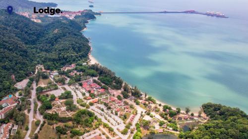 an aerial view of a resort on a hill next to the ocean at AnyLodge Waterfront Marina Island Pangkor in Lumut