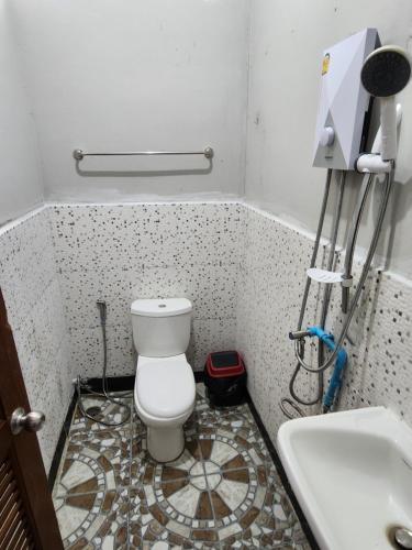 a bathroom with a toilet and a sink at Seven Nine Hostel - Calm place to sleep in Baan Tai