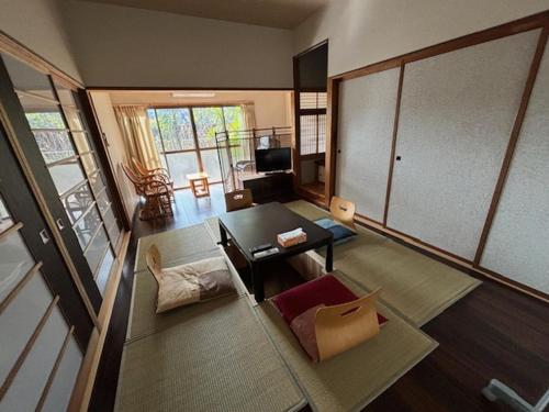an aerial view of a living room with a table at Hostel John Mang ゲストハウス ジョン in Tosa