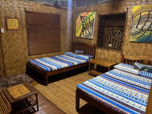 Ein Bett oder Betten in einem Zimmer der Unterkunft Bamboo Nest
