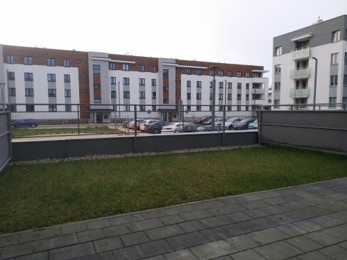 a view of a parking lot with buildings at Apartament Białystok in Białystok