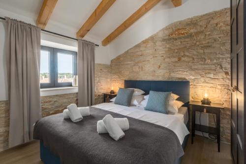 En eller flere senge i et værelse på Casa Masso