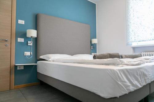 Postel nebo postele na pokoji v ubytování AB&C Arco Bed And Camping