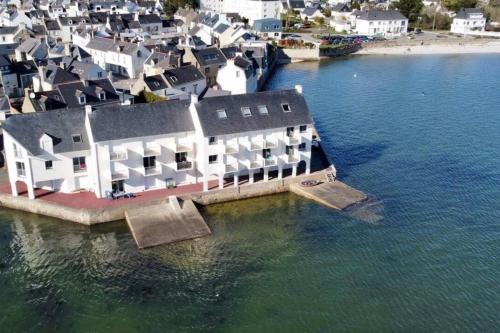 an aerial view of a house in the water at Feet in the water breathtaking 180 sea view! in Port-Louis