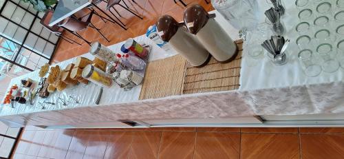 an overhead view of a table with plates and utensils at Pousada Felix in São Gabriel