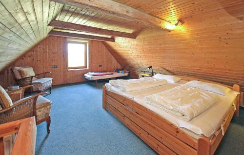 a bedroom with a large bed in a attic at 1 Bedroom Cozy Home In Jabel in Jabel