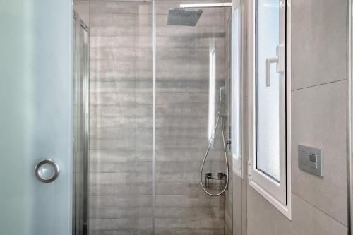 a shower with a glass door in a bathroom at Casa Mara 2 in Playa Quemada