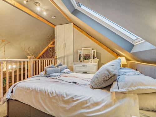 a bedroom with a bed in a attic at 1 Bed in Christchurch 54900 in Ringwood