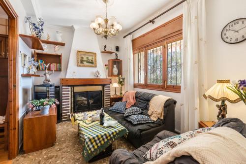 a living room with a couch and a fireplace at Casa Venta Ruizo in Lorca
