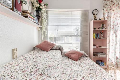 a bedroom with a bed and a window at Casa Venta Ruizo in Lorca