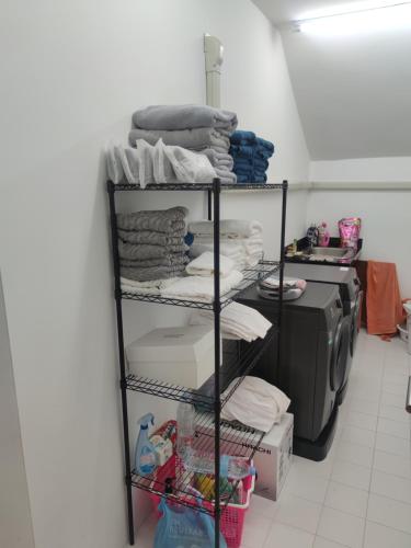 a room with a rack of clothes and a printer at The Residence Resort in Phuket
