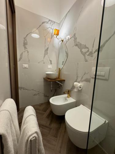 a bathroom with a toilet and a sink at Umi B&B in Giulianova