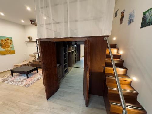 a room with a staircase with a glass ceiling at Casaldo's rooms in Florence