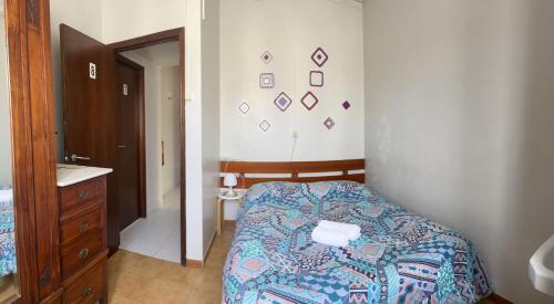 Postel nebo postele na pokoji v ubytování Residência Aviz