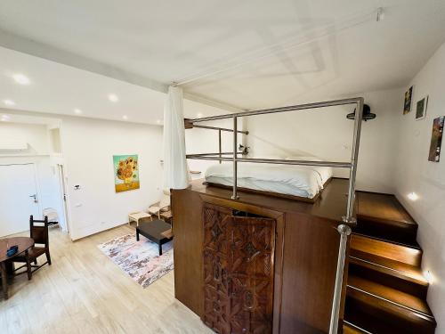 a bedroom with a bunk bed and a desk at Casaldo's rooms in Florence